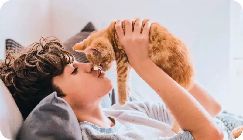 Pet owner with cat